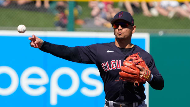 Mar 4, 2023; Mesa, Arizona, USA; Cleveland Guardians second baseman Andres Gimenez (0) makes the play for an out against the Oakland Athletics in the first inning at Hohokam Stadium. Mandatory Credit: Rick Scuteri-USA TODAY Sports